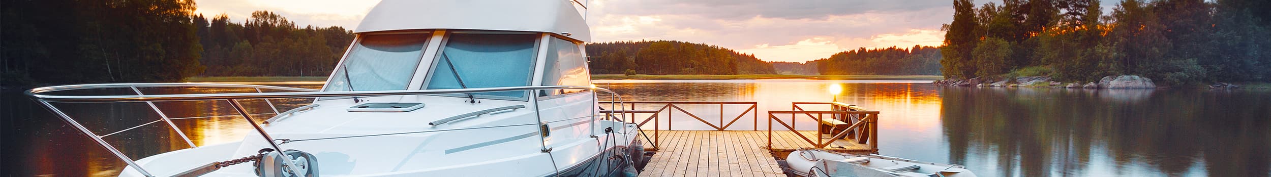 Boat docked on the lake at sunrise